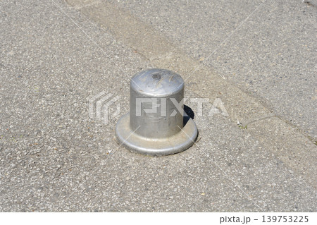 Metal Bollard on Asphalt Street Metal Bollard on Asphalt Street 139753225