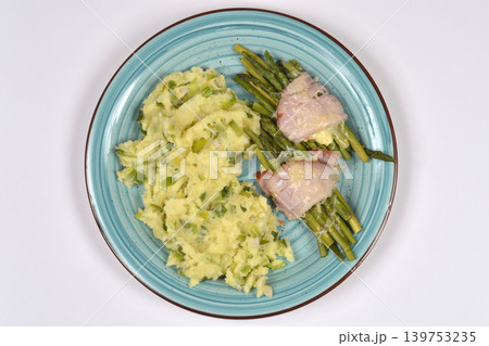 Mashed potatoes with leeks and asparagus wrapped in ham Mashed potatoes with leeks and asparagus wrapped in ham 139753235