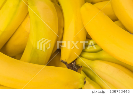 Bunch yellow ripe fresh fruit organic banana background bright vibrant tropical food Bunch yellow ripe fresh fruit organic banana background bright vibrant tropical food 139753446