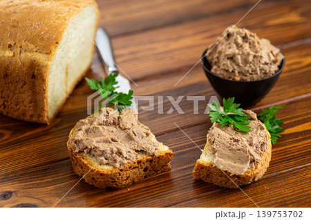 Homemade liver pate served on toasted bread background 139753702