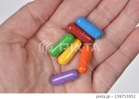 Handful of colorful medical capsules 139753952