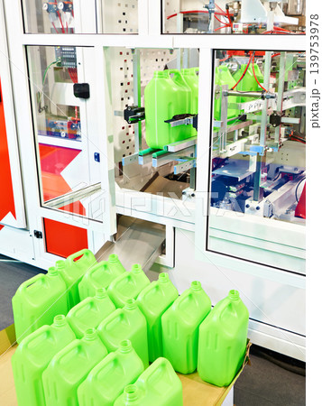 Plastic cans on factory conveyor 139753978