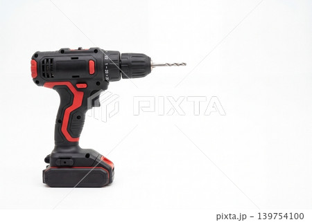 A modern cordless screwdriver with a thin drill bit, isolated on a light background with plenty of space for text. Suitable for repair, construction, installation and DIY topics. A modern cordless screwdriver with a thin drill bit, isolated on a light background with plenty of space for text. Suitable for repair, construction, installation and DIY topics. 139754100