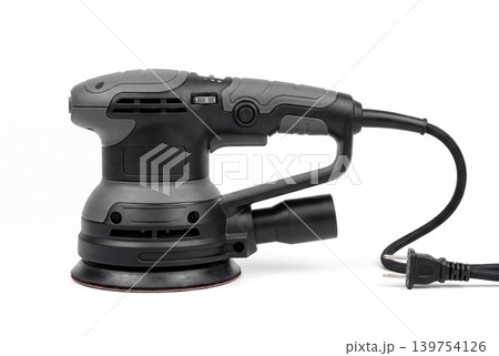 Black electric orbital sander with sanding pad, dust extraction port and power cord isolated on white background. Professional handheld tool for woodworking, renovation, finishing and DIY projects. Black electric orbital sander with sanding pad, dust extraction port and power cord isolated on white background. Professional handheld tool for woodworking, renovation, finishing and DIY projects. 139754126
