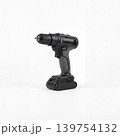 Modern cordless drill isolated on white background, shown in clean studio lighting. Portable power tool for repair, construction, installation, furniture assembly, workshop, and DIY use. 139754132