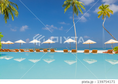 Luxury resort infinity pool sunbeds umbrellas palm trees fantastic summer travel landscape breathtaking stunning dreamy serene paradise exotic coastal stunning vibrant idyllic scenic vacation destinat Luxury resort infinity pool sunbeds umbrellas palm trees fantastic summer travel landscape breathtaking stunning dreamy serene paradise exotic coastal stunning vibrant idyllic scenic vacation destinat 139754171