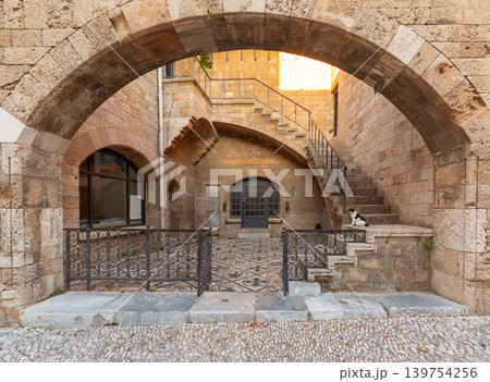 Stone archway and staircase in historic courtyard of Rhodes Old Town Stone archway and staircase in historic courtyard of Rhodes Old Town 139754256