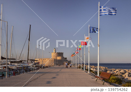 Greek and European Flags Along Mandraki Harbor in Rhodes 139754262