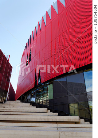 Exterior view of Horacka multifunctional arena in Jihlava, Vysocina region, Czechia, on a sunny day, showing modern architecture from open public surroundings 139754604