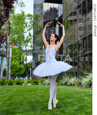 Ballerina posing on pointe on lawn in San Jose 139754635
