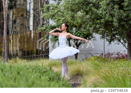 Ballerina dancing among tall grass in San Jose Ballerina dancing among tall grass in San Jose 139754638