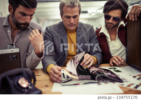 Businessman, group and magazine design planning in a retro creative agency with strategy. Idea, brainstorming and vintage male people with media publishing and graphic samples for journalism Businessman, group and magazine design planning in a retro creative agency with strategy. Idea, brainstorming and vintage male people with media publishing and graphic samples for journalism 139755170
