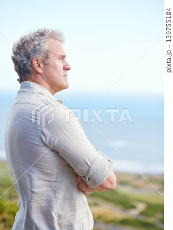 Old man, relax and thinking at beach in retirement with ideas for health, holiday and mindfulness. Mature, person and planning a decision for future in mockup space with blue sky, ocean and sea Old man, relax and thinking at beach in retirement with ideas for health, holiday and mindfulness. Mature, person and planning a decision for future in mockup space with blue sky, ocean and sea 139755184
