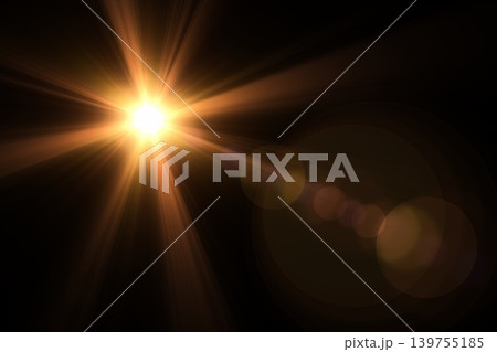 Golden sunburst lens flare with optical starburst rays and bokeh on black 139755185
