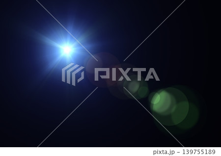 Optical lens flare light burst with blue rays and bokeh over black Optical lens flare light burst with blue rays and bokeh over black 139755189