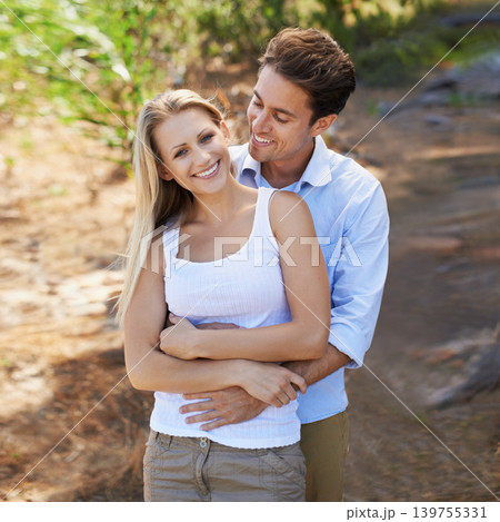 Nature portrait, love and happy couple hug for support, romantic care and relationship security with marriage partner. Embrace, wellness and relax outdoor man, woman or people smile for forest date 139755331