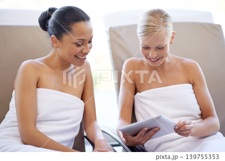 Women, tablet and spa after massage with facial menu or hotel beauty treatment with smile. Relax, calm and happy from physical therapy, care and hospitality from skincare and wellness with people Women, tablet and spa after massage with facial menu or hotel beauty treatment with smile. Relax, calm and happy from physical therapy, care and hospitality from skincare and wellness with people 139755353