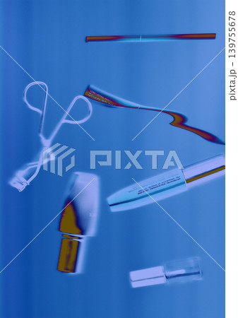 Cosmetic tools and beauty products in blue neon light, underwater. Modern aesthetic of biotechnology, aesthetics, and high-tech skincare innovation. Cosmetic tools and beauty products in blue neon light, underwater. Modern aesthetic of biotechnology, aesthetics, and high-tech skincare innovation. 139755678