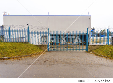 Secure institutional environment. Restricted area featuring security measures and monitoring devices Secure institutional environment. Restricted area featuring security measures and monitoring devices 139756162