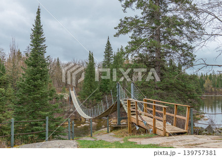 Suspension Bridge In Forest Landscape. Pinawa. Suspension Bridge In Forest Landscape. Pinawa. 139757381