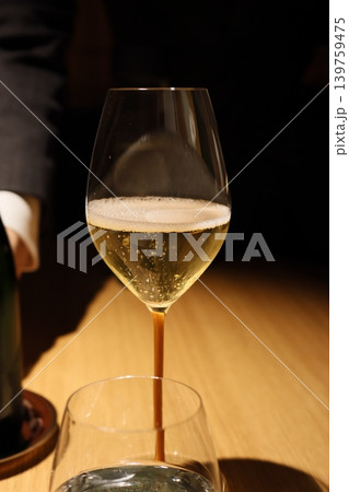 Sparkling Wine Pouring into Glass Close-up 139759475