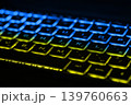 Beautiful colorful modern keyboard with blue and yellow backlight. Backlight of the keyboard in colors of Ukrainian flag 139760663