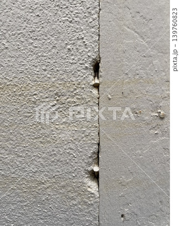 Vertical Crack In Concrete Wall With Metal Nails Vertical Crack In Concrete Wall With Metal Nails 139760823