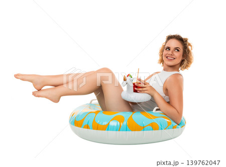 Woman relaxes in float, holding drink and smiling, PNG Woman relaxes in float, holding drink and smiling, PNG 139762047