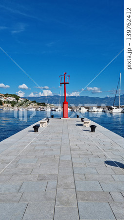 Red Lighthouse on Stone Pier in Baska 139762412