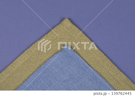 Folded Waffle Towels on Blue Background Folded Waffle Towels on Blue Background 139762445