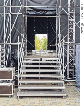 Rear view of a stage construction with metal stairs Rear view of a stage construction with metal stairs 139763051