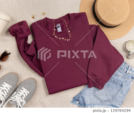 Blank dark red unisex sweatshirt mockup, folded crewneck flat lay with copy space on front Blank dark red unisex sweatshirt mockup, folded crewneck flat lay with copy space on front 139764294