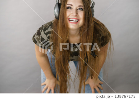 Teen women wearing headphones Teen women wearing headphones 139767175