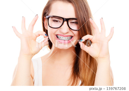 Happy nerdy teenage with brace wearing eyeglasses 139767208