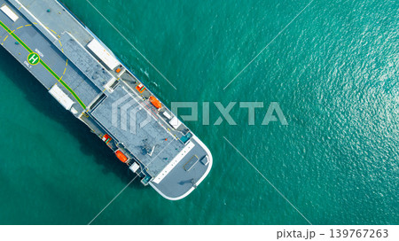 Aerial top view vehicles carrier on sea, Ro Ro (Roll on Roll off) automobile carrier vessel international car terminal, Automobile industry distribution logistic transport new car. Aerial top view vehicles carrier on sea, Ro Ro (Roll on Roll off) automobile carrier vessel international car terminal, Automobile industry distribution logistic transport new car. 139767263
