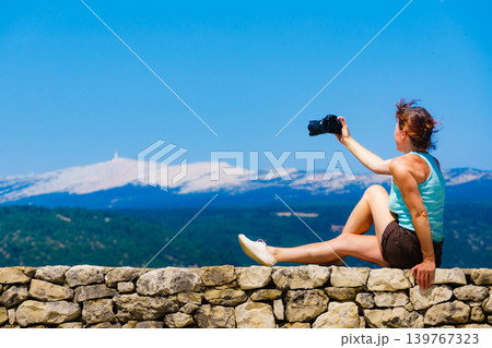 Woman take photo on mountain nature in France Woman take photo on mountain nature in France 139767323