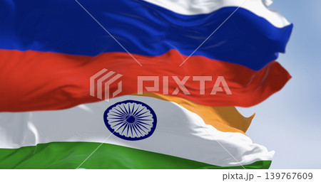 The flags of India and Russia waving in the wind on a clear day The flags of India and Russia waving in the wind on a clear day 139767609