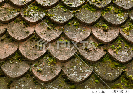 Aged Traditional Clay Roof Tiles Texture Background with Cracked Antique Stone Surface, Vintage Weathered Roof 139768189