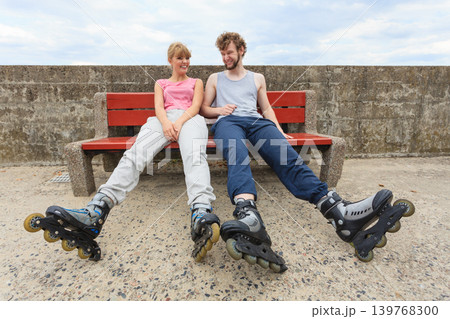 Young people friends relaxing on bench. Young people friends relaxing on bench. 139768300