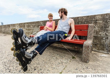 Young people friends relaxing on bench. Young people friends relaxing on bench. 139768301