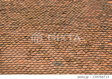 Aged Traditional Roof Tiles Texture Background with Cracked Antique Stone Surface, Vintage Weathered Roof 139768713