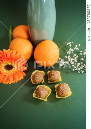 Healthy energy balls with oranges, gerbera daisy, and baby's breath Healthy energy balls with oranges, gerbera daisy, and baby's breath 139768877