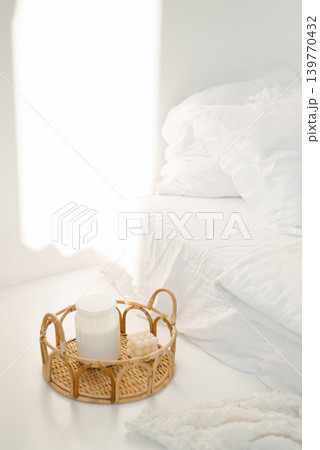 Cozy Bedroom Interior with Rattan Tray Candle Cozy Bedroom Interior with Rattan Tray Candle 139770432