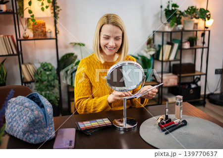 Enjoying a moment of creativity while preparing for a special occasion in a cozy botanical-themed space Enjoying a moment of creativity while preparing for a special occasion in a cozy botanical-themed space 139770637