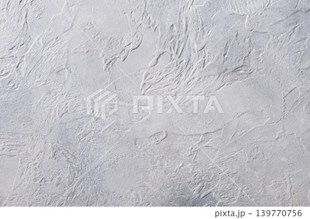 White textured plaster wall background with minimal abstract pattern White textured plaster wall background with minimal abstract pattern 139770756
