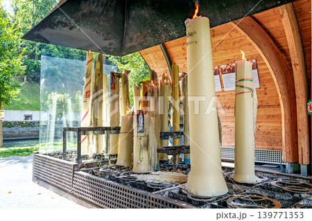 Specially crafted candles burning in Lourdes. One of the great traditions of Lourdes Specially crafted candles burning in Lourdes. One of the great traditions of Lourdes 139771353
