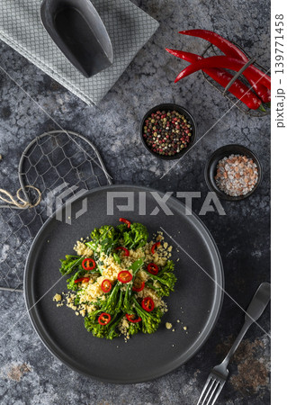 Delicious gourmet dish of roasted broccoli and couscous seasoned with chili pepper 139771458
