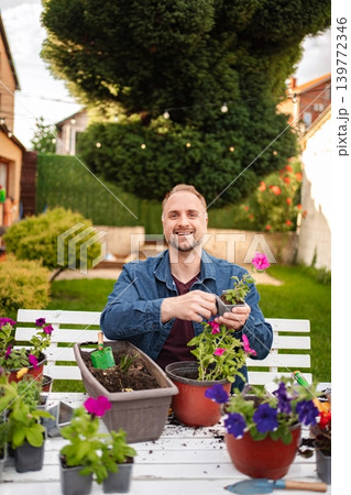 Gardening joy in a vibrant backyard oasis Gardening joy in a vibrant backyard oasis 139772346