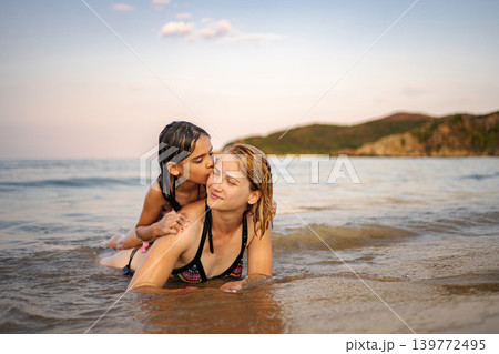 Mother and daughter enjoying summer vacation on Greece beach 139772495