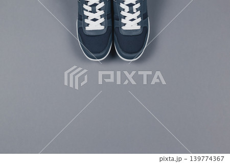 Grey sneakers on the grey background. Concept for healthy lifestyle and everyday training. 139774367